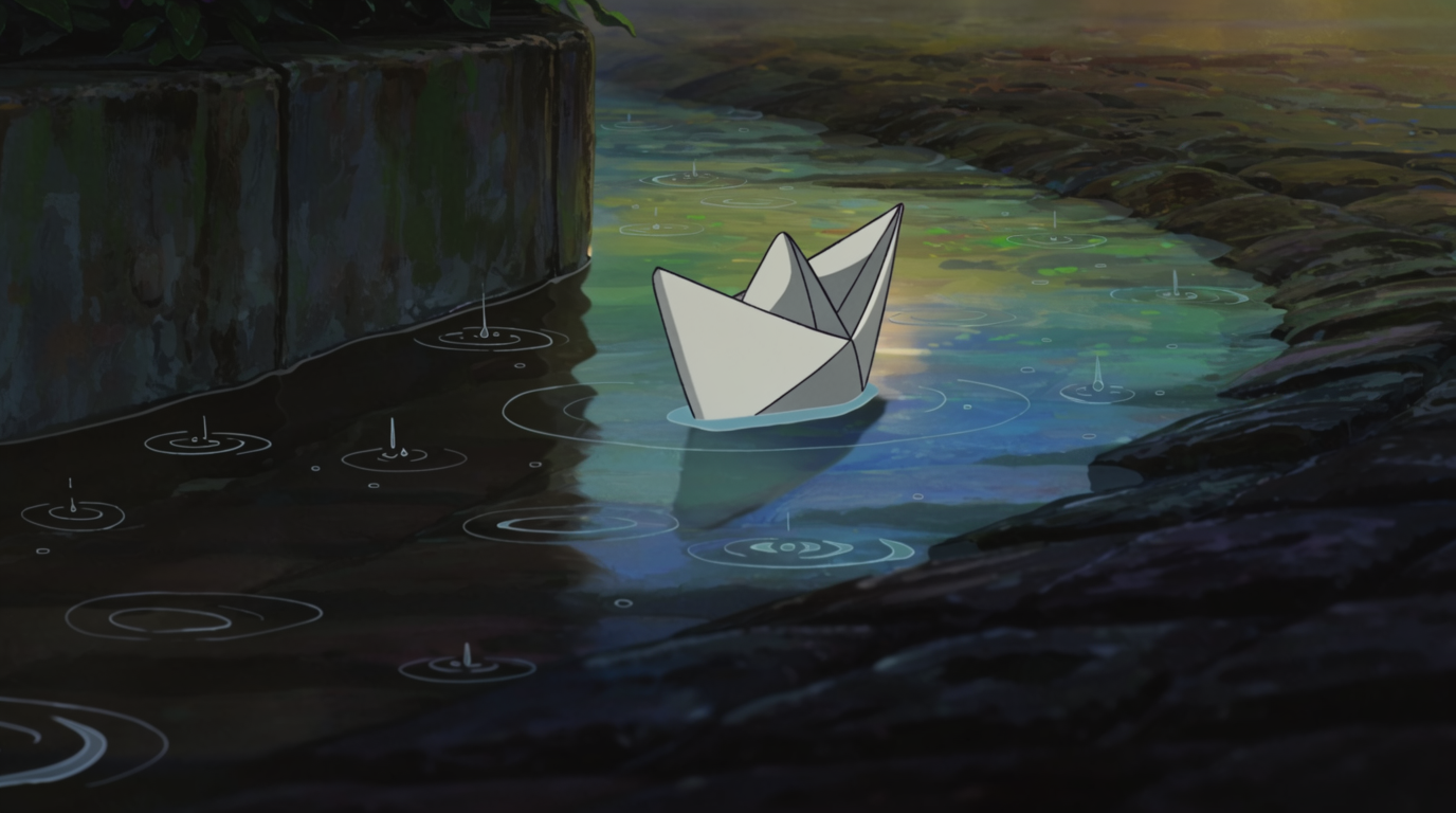 Bateau en Papier dans le Caniveau